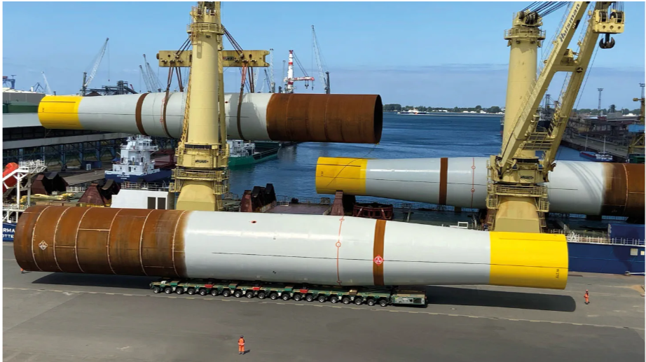 Monopiles are offloaded from the delivery vessel for storage, before being transferred to the installation vessel. Hornsea 2’s monopiles are between 60m and 78m long (varying because of different sea depths).